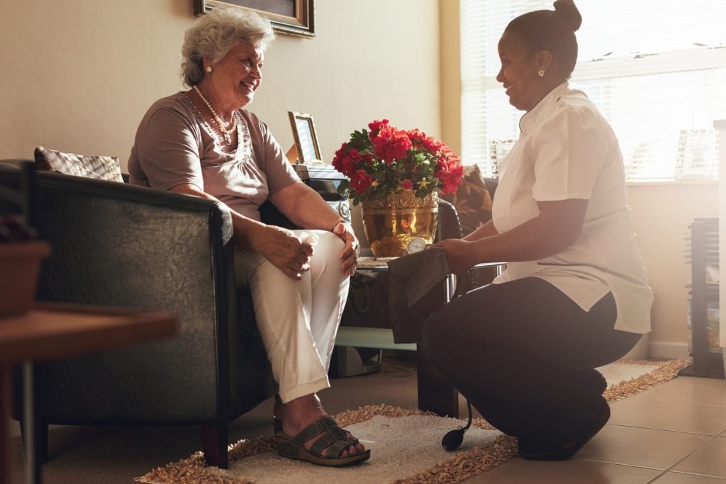 Female Nurse Visiting Senior Patient For Checking Blood Pressure in Ardmore, PA