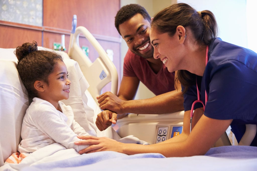 Pediatrician Visiting Father And Child In Hospital Bed in Glenolden PA Pediatrician Visiting Father And Child In Hospital Bed in Glenolden PA